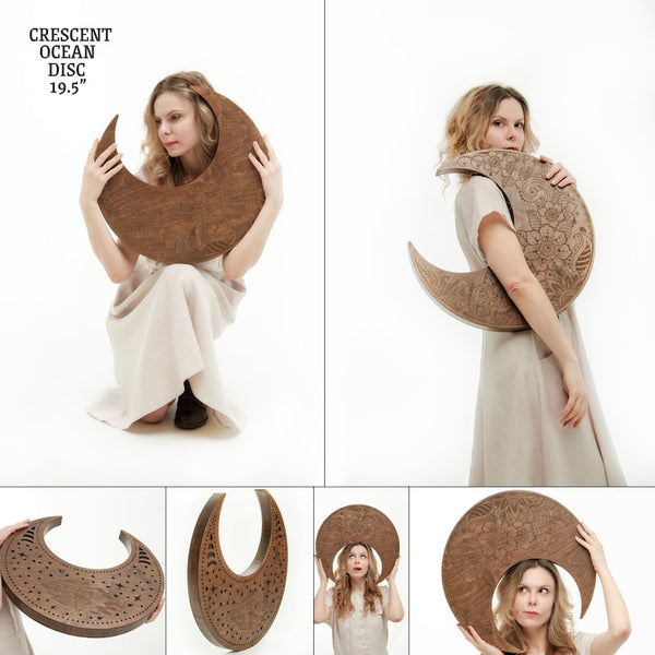 woman holding the Nazar Crescent Waterfall Disc to show multiple angle views of the instrument and sizing