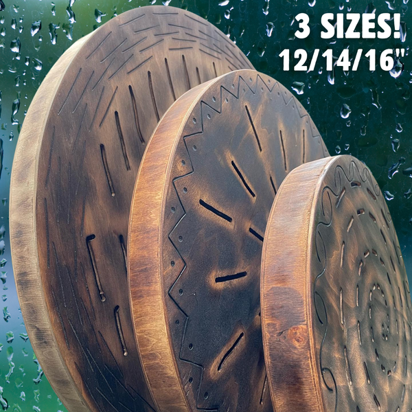 side showing three sizes of wooden Water-Fall Discs stacked against each other shown on rainy glass background
