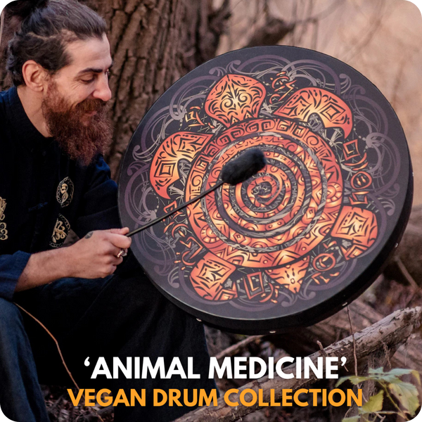 man sitting and drumming on a Nazar Vegan Drum with a turtle graphic in the woods 